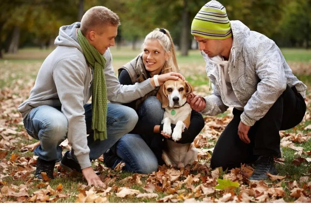 group of friends with a young puppy